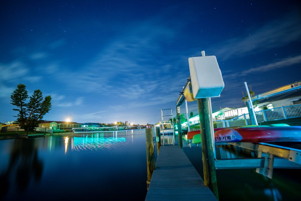 a boat is docked at the end of a pier