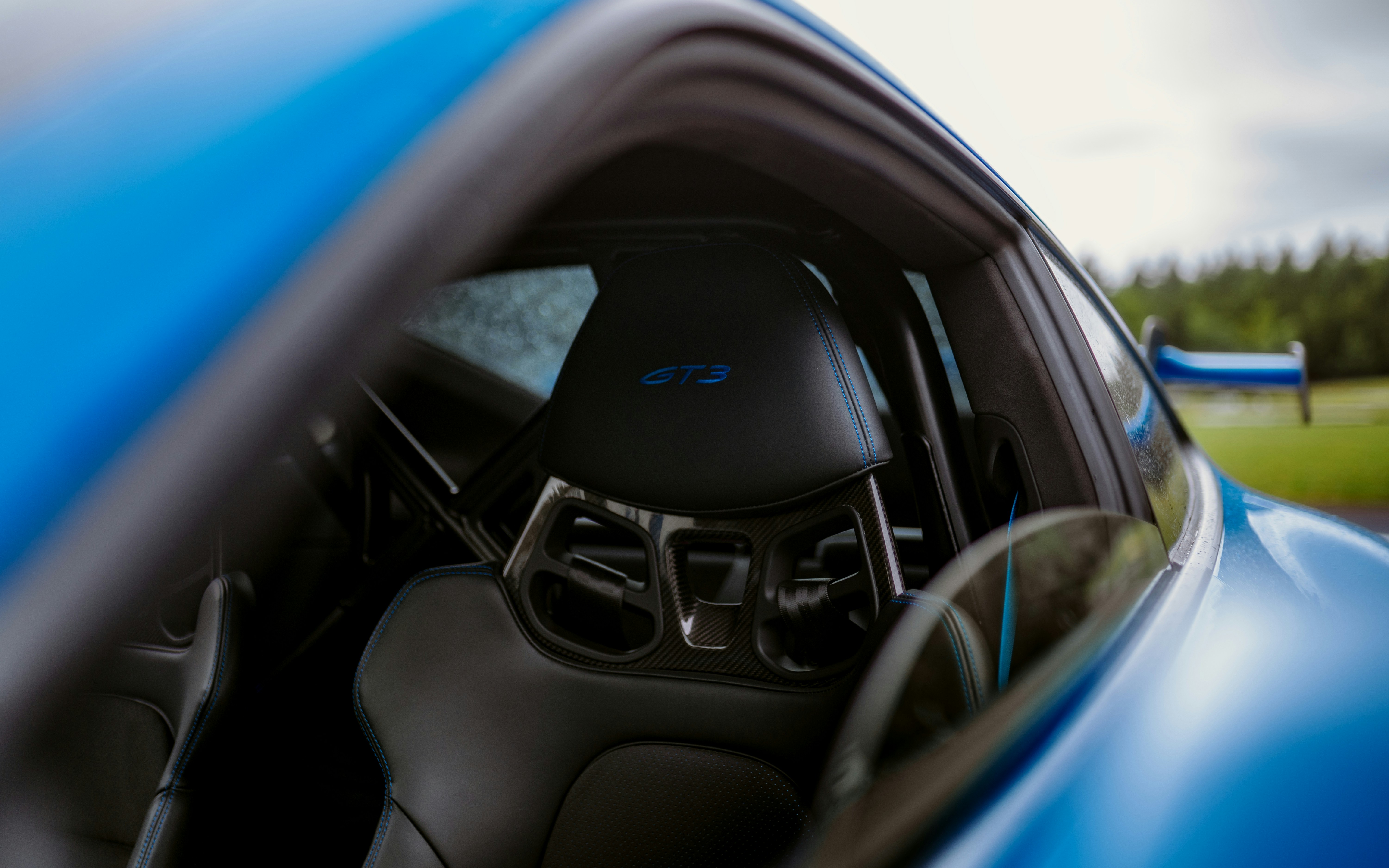 Closeup of an electric vehicle dashboard showing battery state of charge and remaining range