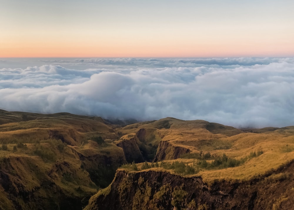 a view of a mountain range with clouds in the sky