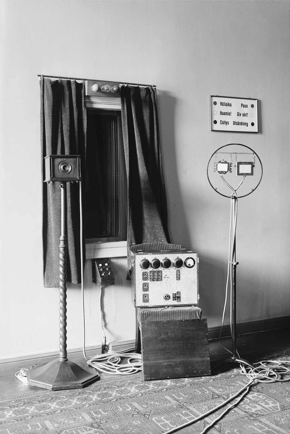a room with a clock, a radio and a speaker