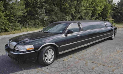 A stretch limousine with tinted windows, ready for a special occasion.