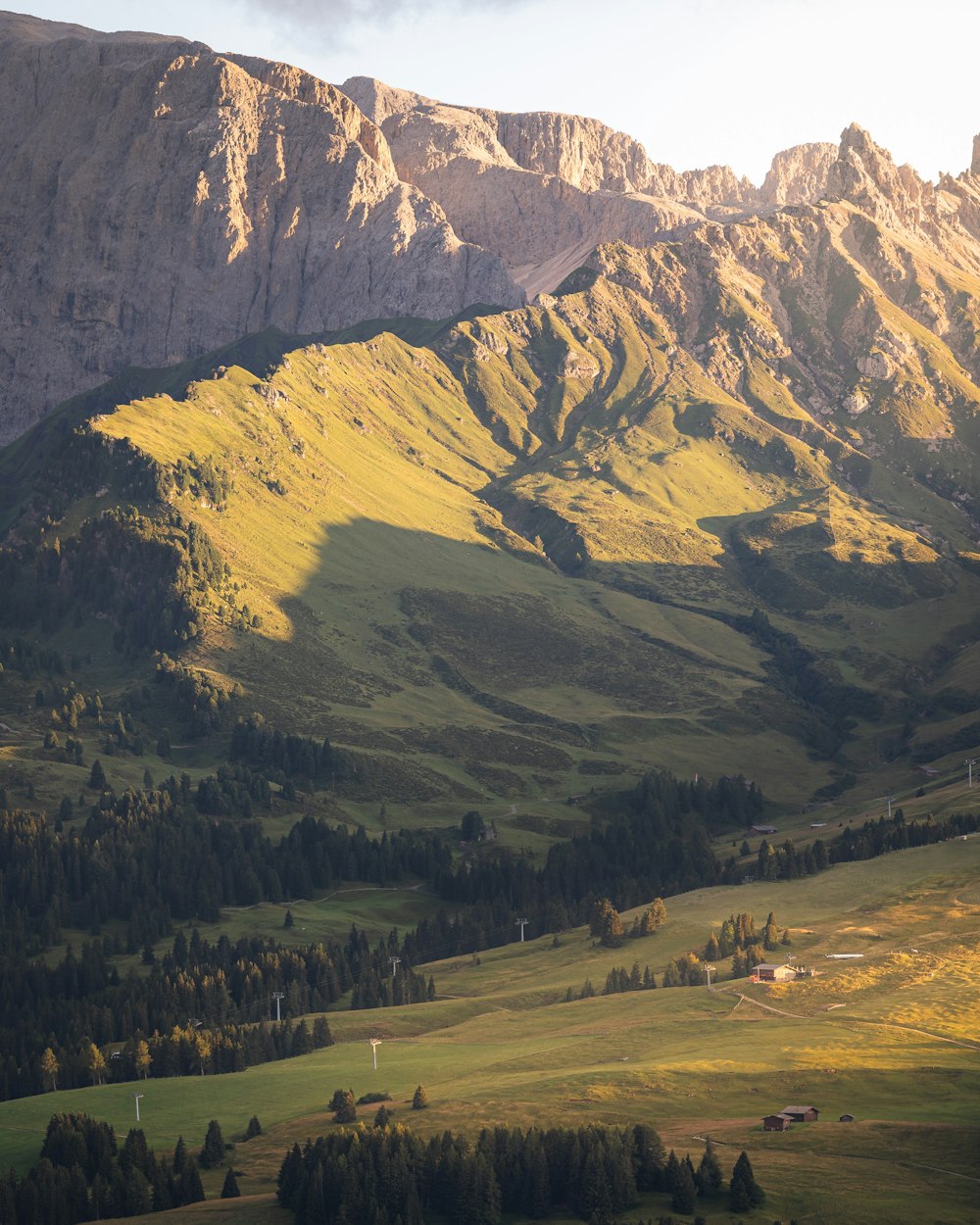 a view of a valley with mountains in the background