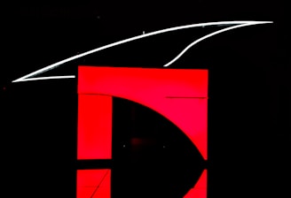 A modern training page layout showcasing red, charcoal black, and white colors.