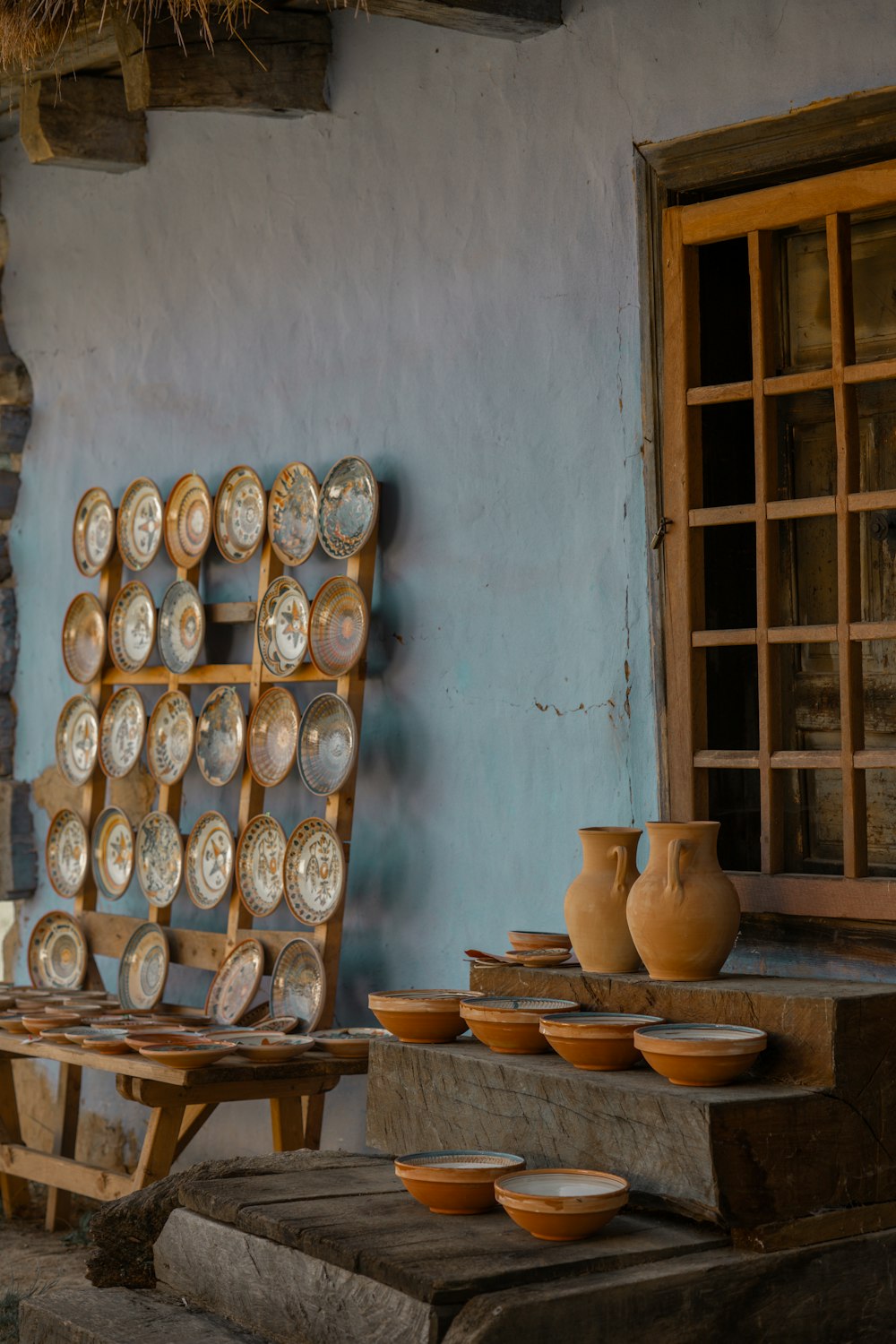 a group of bowls sitting on top of a wooden table