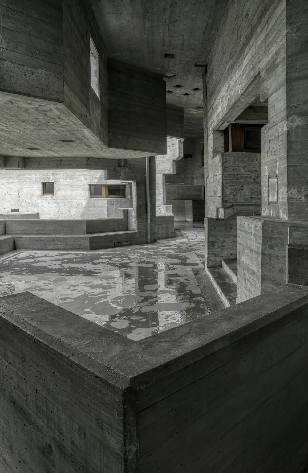 a room with a concrete floor and walls
