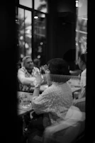 A candid moment of citizens discussing politics over coffee in a local café.