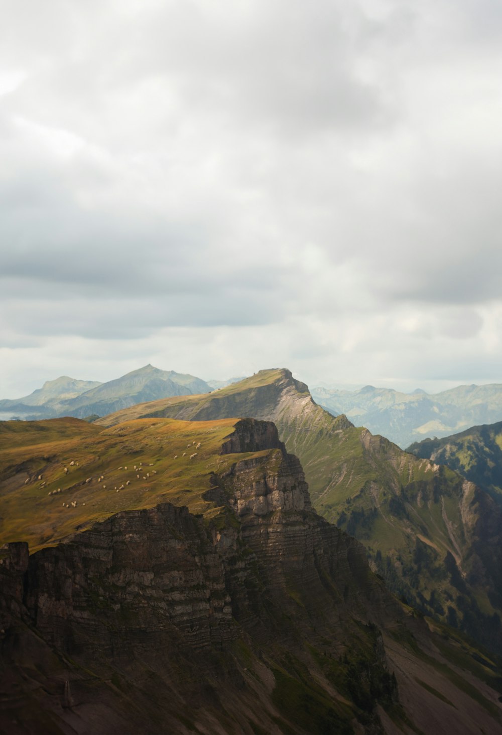 a view of a mountain range with mountains in the background