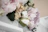 Soft natural bouquet arrangement with warm white and pale pink tones.
