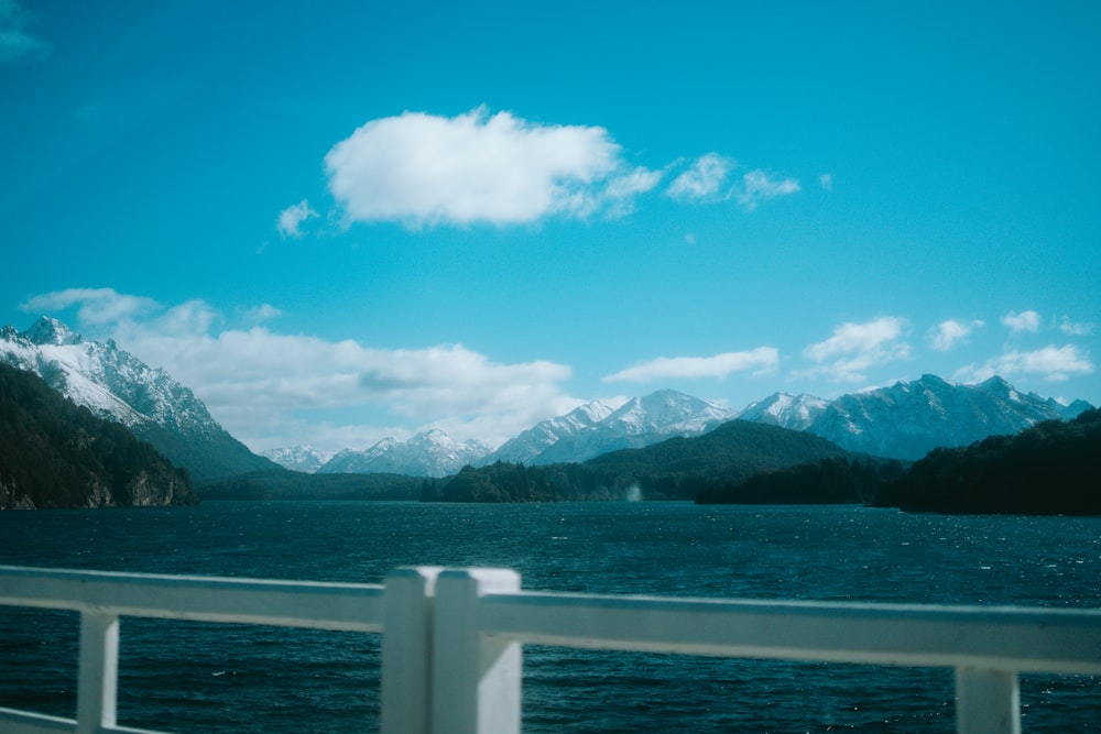 a body of water with mountains in the background