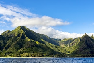 a mountain range with a body of water in front of it