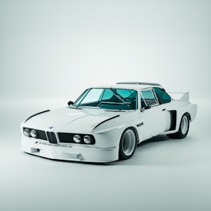 Front view of a Corvette C8 with a minimalist wrap and custom wheel stance in a dark studio