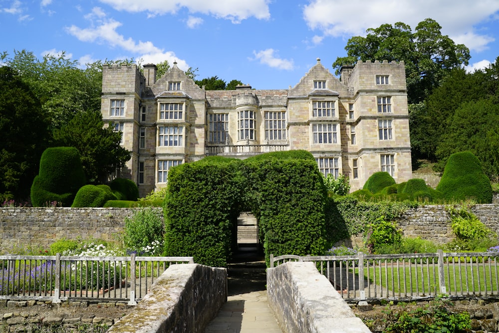 a large stone building with a gate in front of it