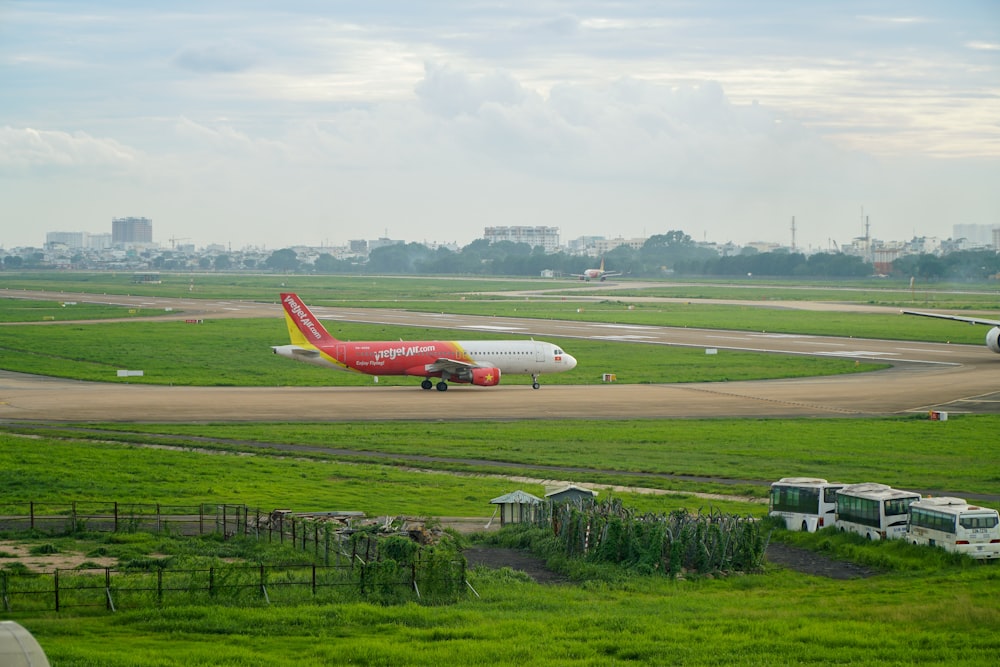 a large jetliner sitting on top of an airport runway