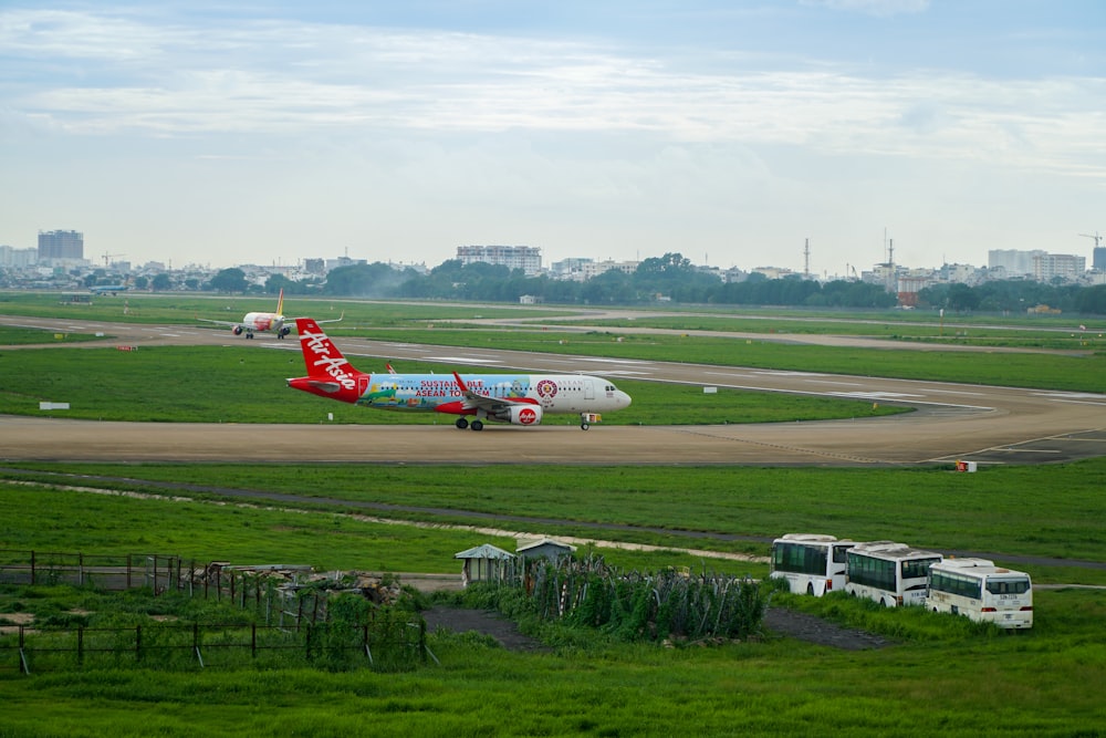 a large jetliner sitting on top of an airport runway