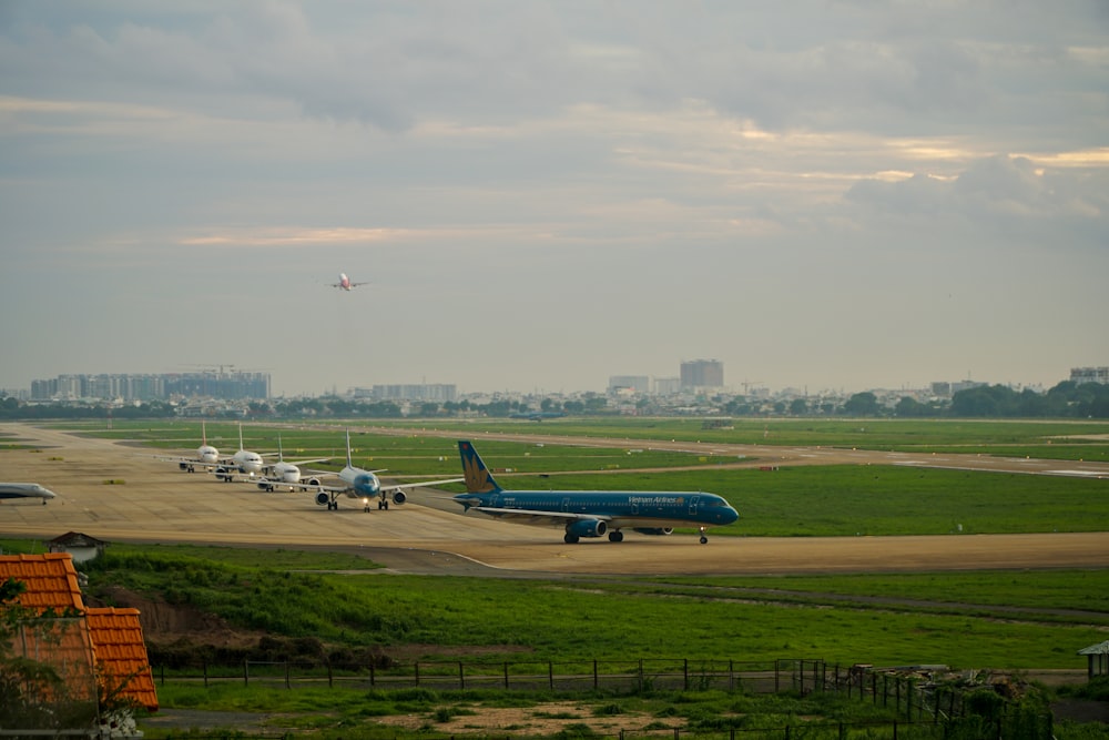 a group of airplanes parked on a runway