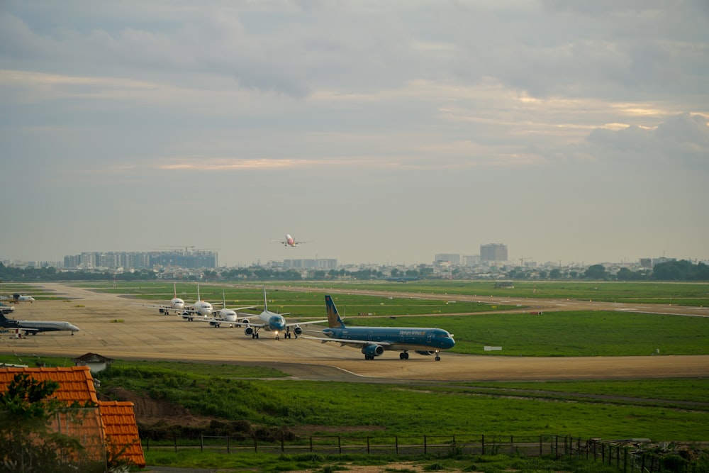 a group of airplanes parked on a runway