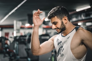 A fitness enthusiast smiling after a workout session.