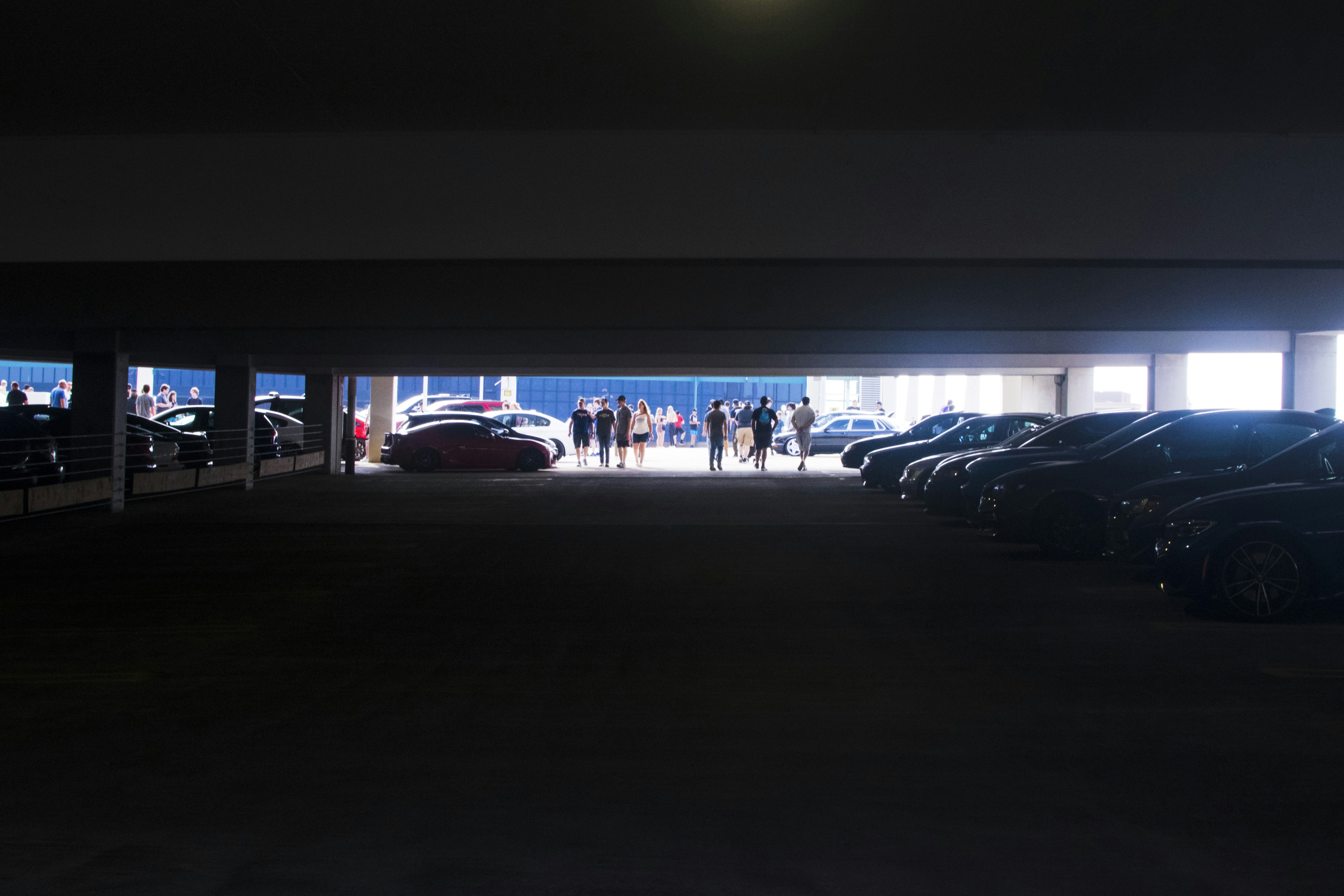 a parking garage filled with lots of parked cars