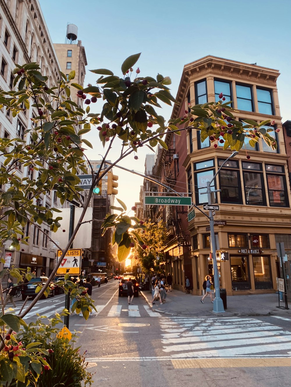 a city street with a crosswalk and a street sign