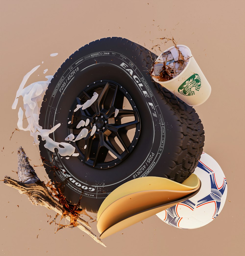 a tire and a cup of coffee sitting on top of each other