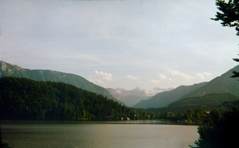 a lake surrounded by mountains and trees