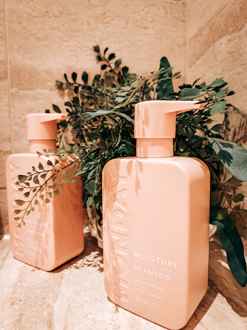 A serene morning scene with Willow Caring shampoo bottle beside a bathroom sink