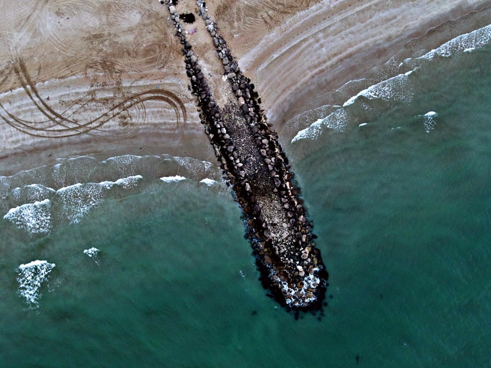 an aerial view of a boat in the water