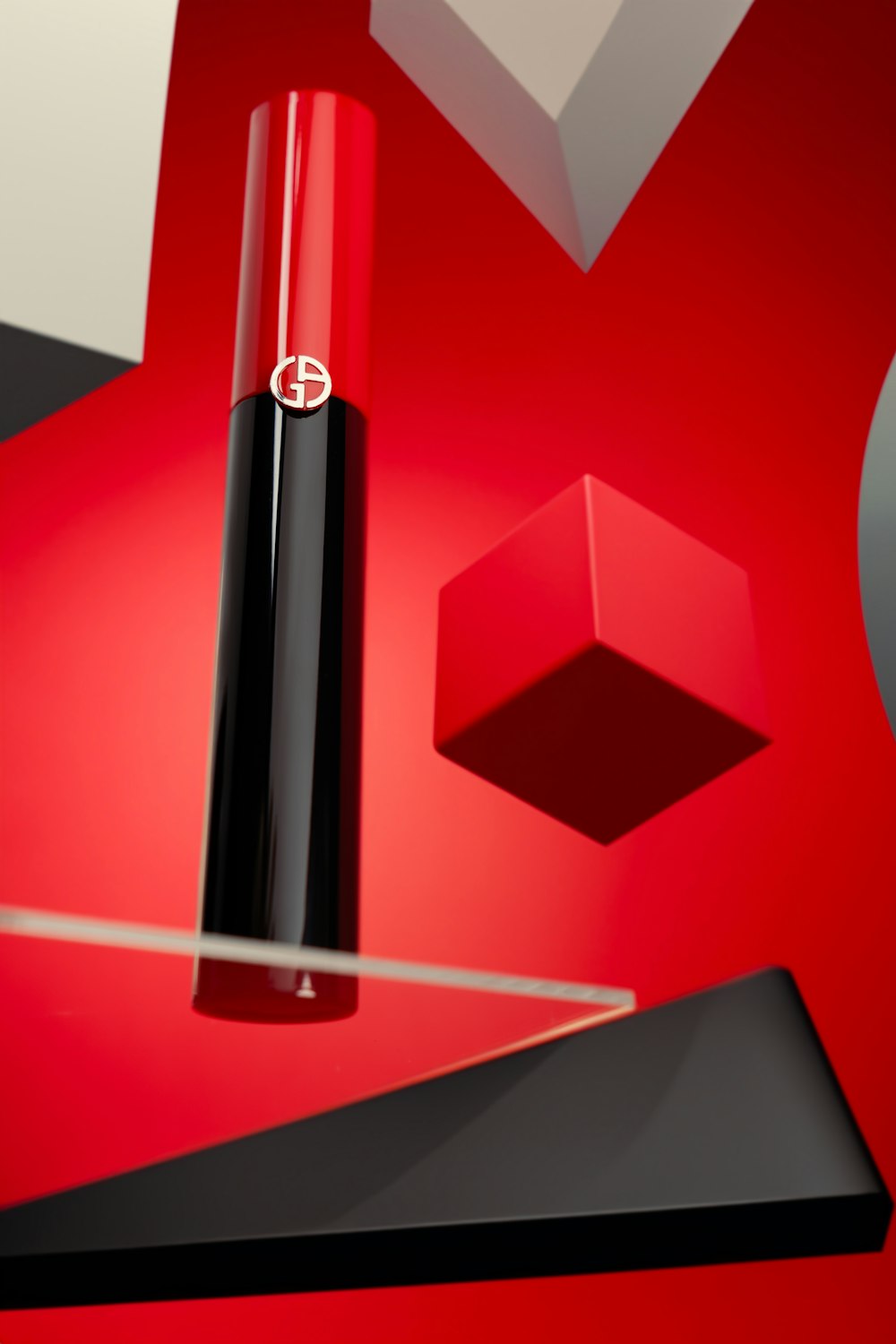 a red and black object on a red surface