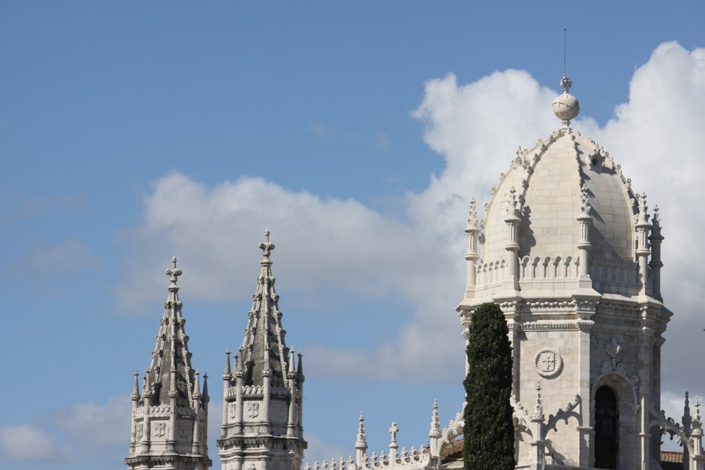 a large white building with a clock on it's side