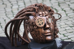 a sculpture of a human head with wires attached to it
