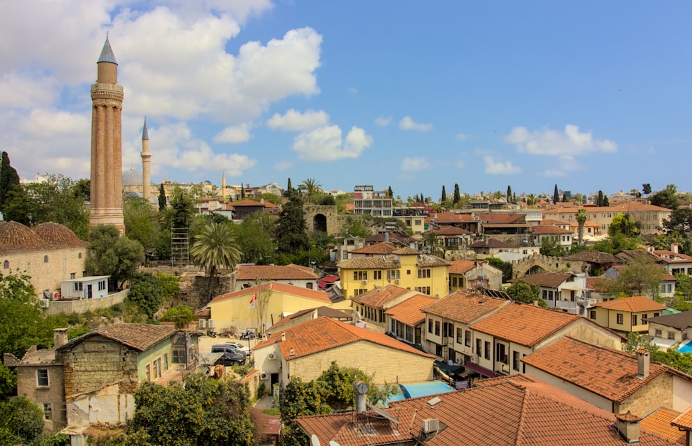 a view of a city with a tall tower in the background