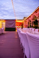 An outdoor dining setup with string lights and decor.
