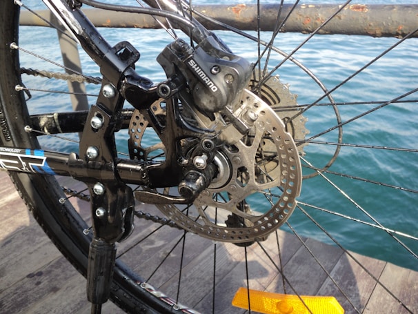 Side view of a sleek dingxial brake caliper mounted on a mountain bike