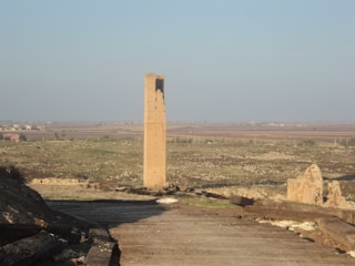 The ancient One Tower rising above a vast landscape.
