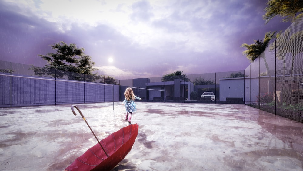 a little girl holding a red umbrella on top of a tennis court