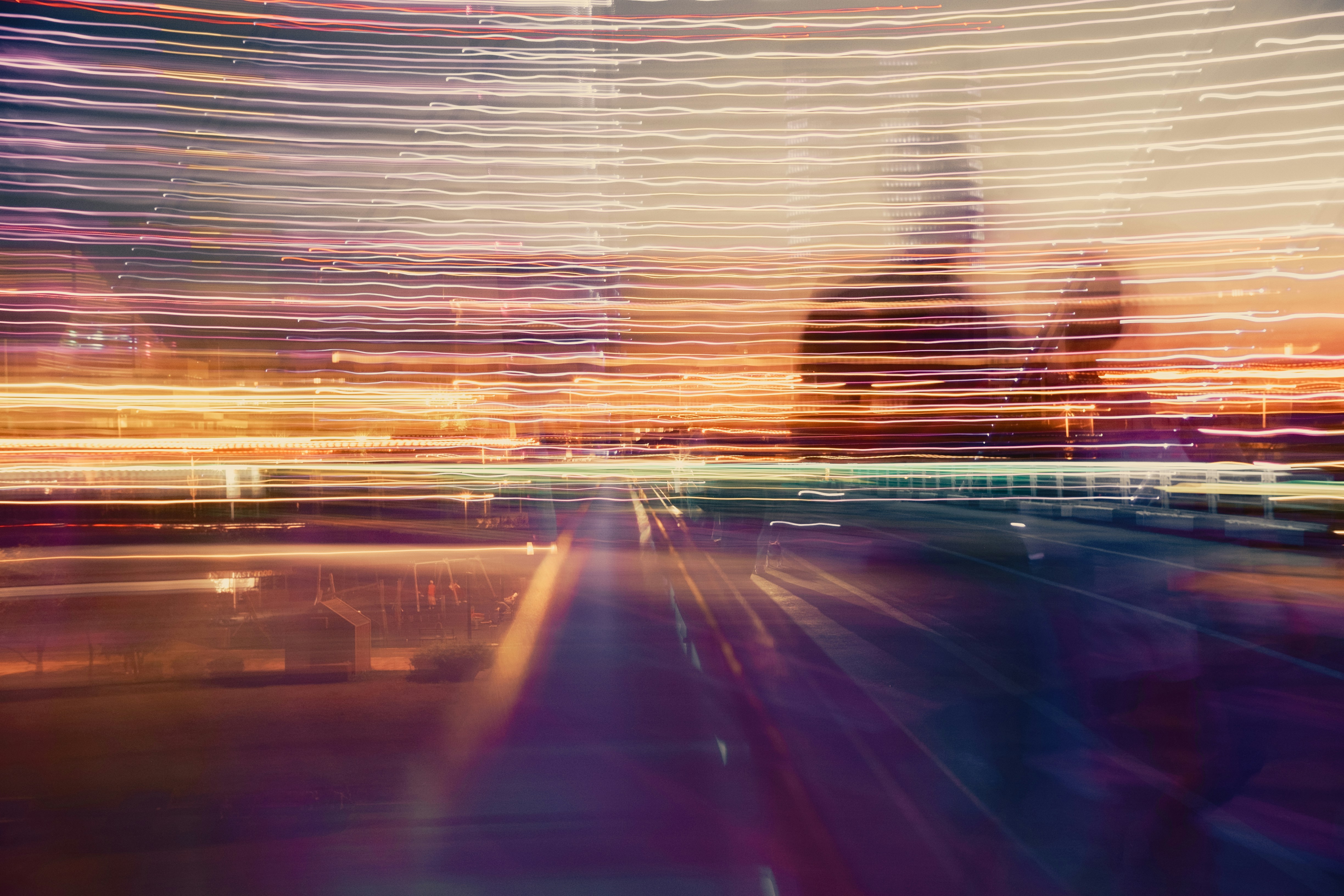 a blurry photo of a city street at night