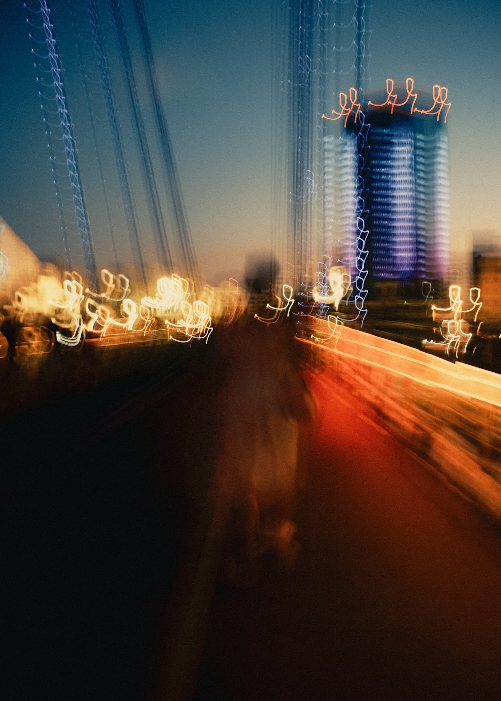 a blurry photo of a city street at night