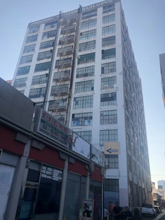 Wide shot of a commercial building equipped with multiple fire safety devices and sprinklers.