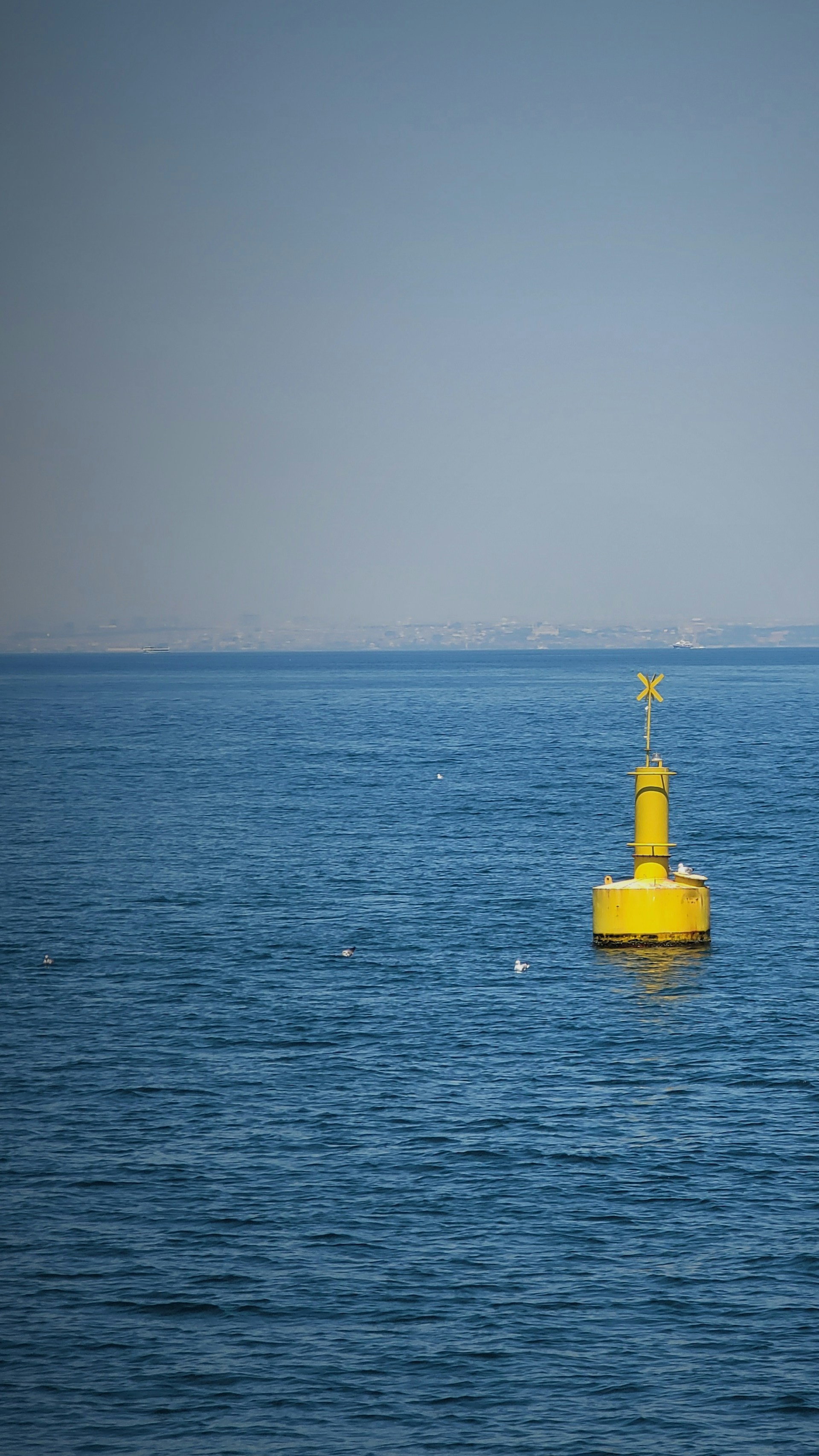 woman wearing yellow long-sleeved dress under white clouds and blue sky during daytime