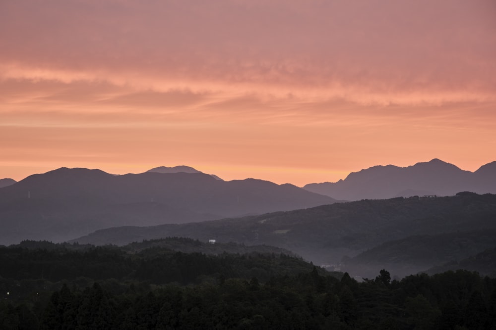 a view of a mountain range at sunset