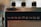 A close-up view of an old-fashioned radio with three black knobs on top and the brand name 'Nordmende' visible. The front features a grid-like speaker pattern.