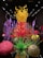 A vibrant display of blown glass sculptures featuring swirling shapes and a mix of colors. The centerpiece is a towering structure with yellow and orange tendrils surrounded by various organic forms, including green spiky plants and spherical objects in red and pink hues. The art pieces are set against a dark backdrop, creating a striking contrast.