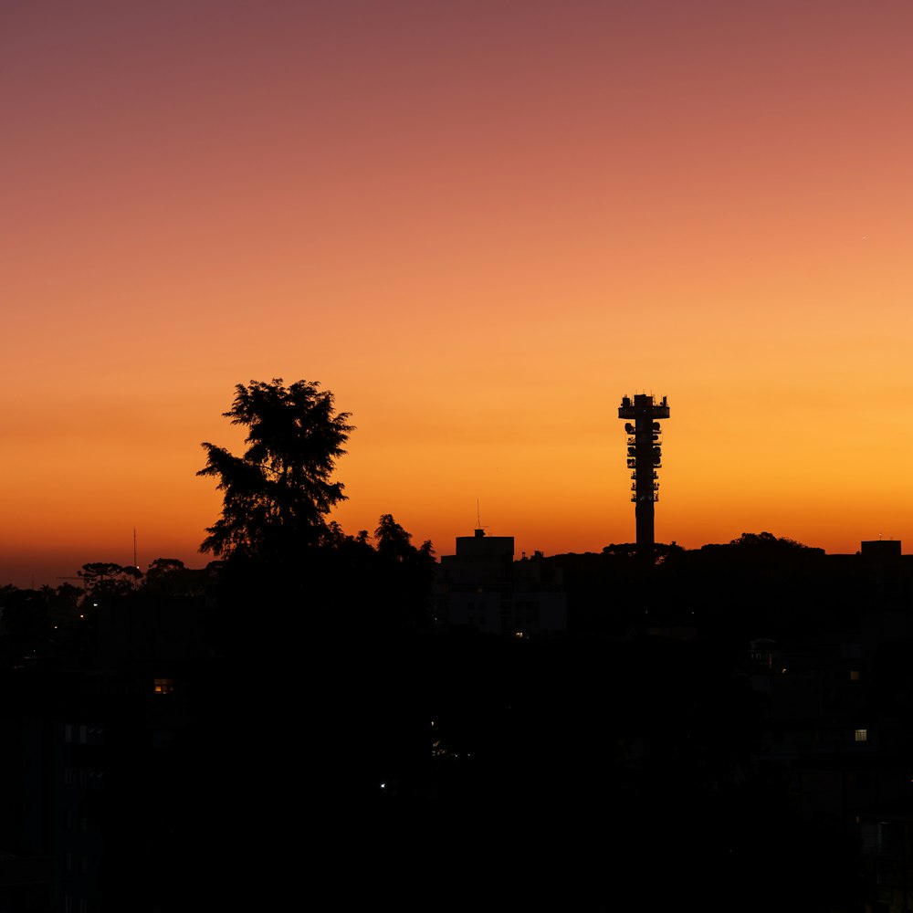 a view of a city skyline at sunset