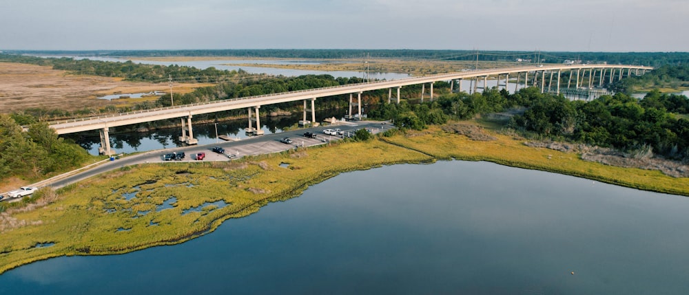 an aerial view of a bridge over a body of water