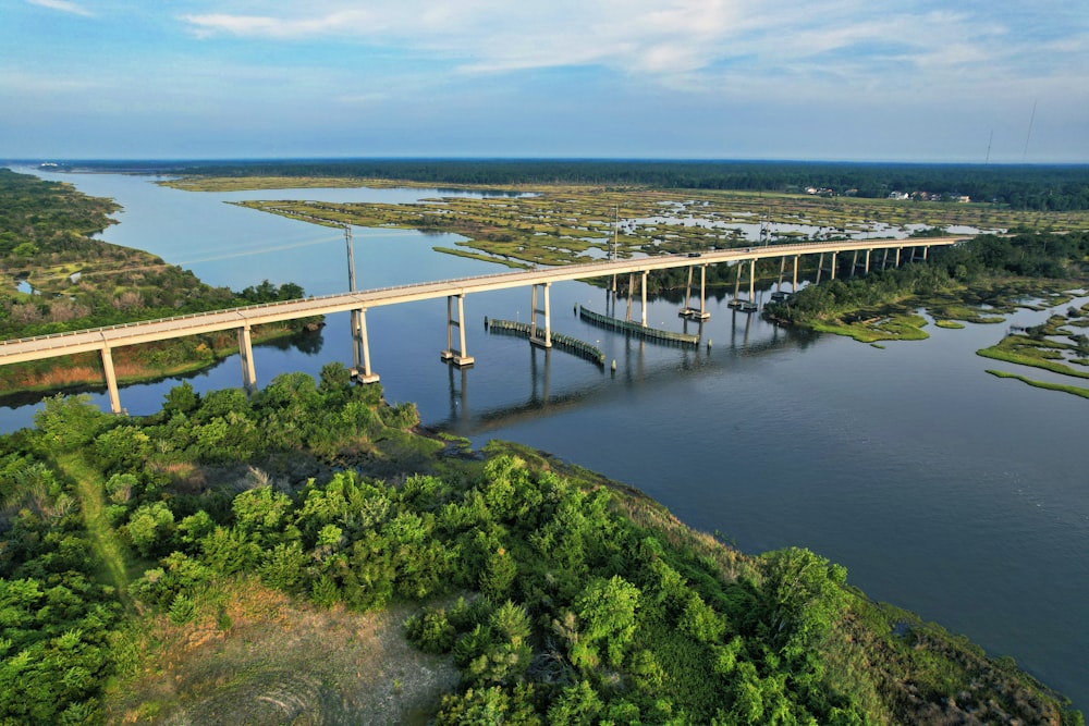 an aerial view of a bridge over a body of water