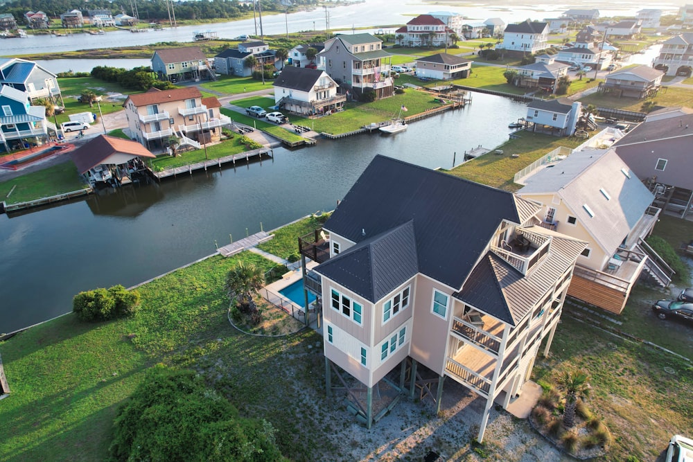 an aerial view of a house on the water