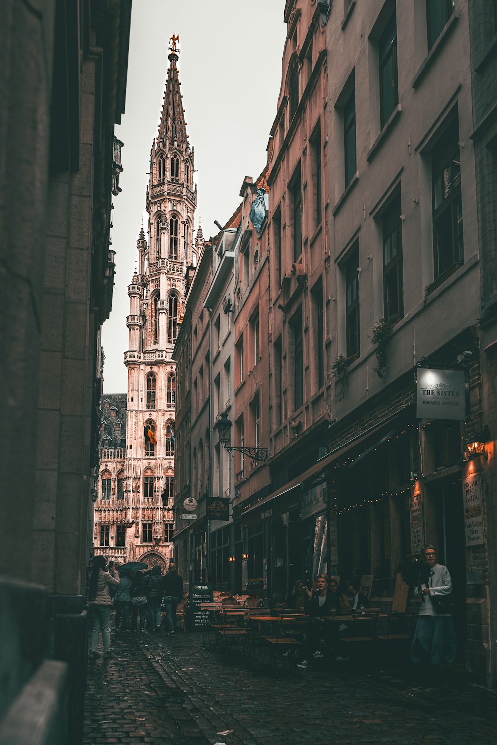 a city street with a clock tower in the background