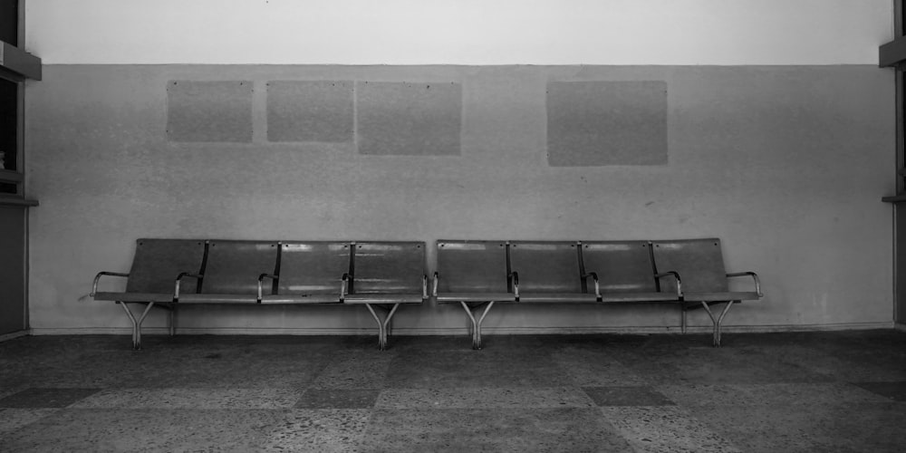 a black and white photo of a waiting area