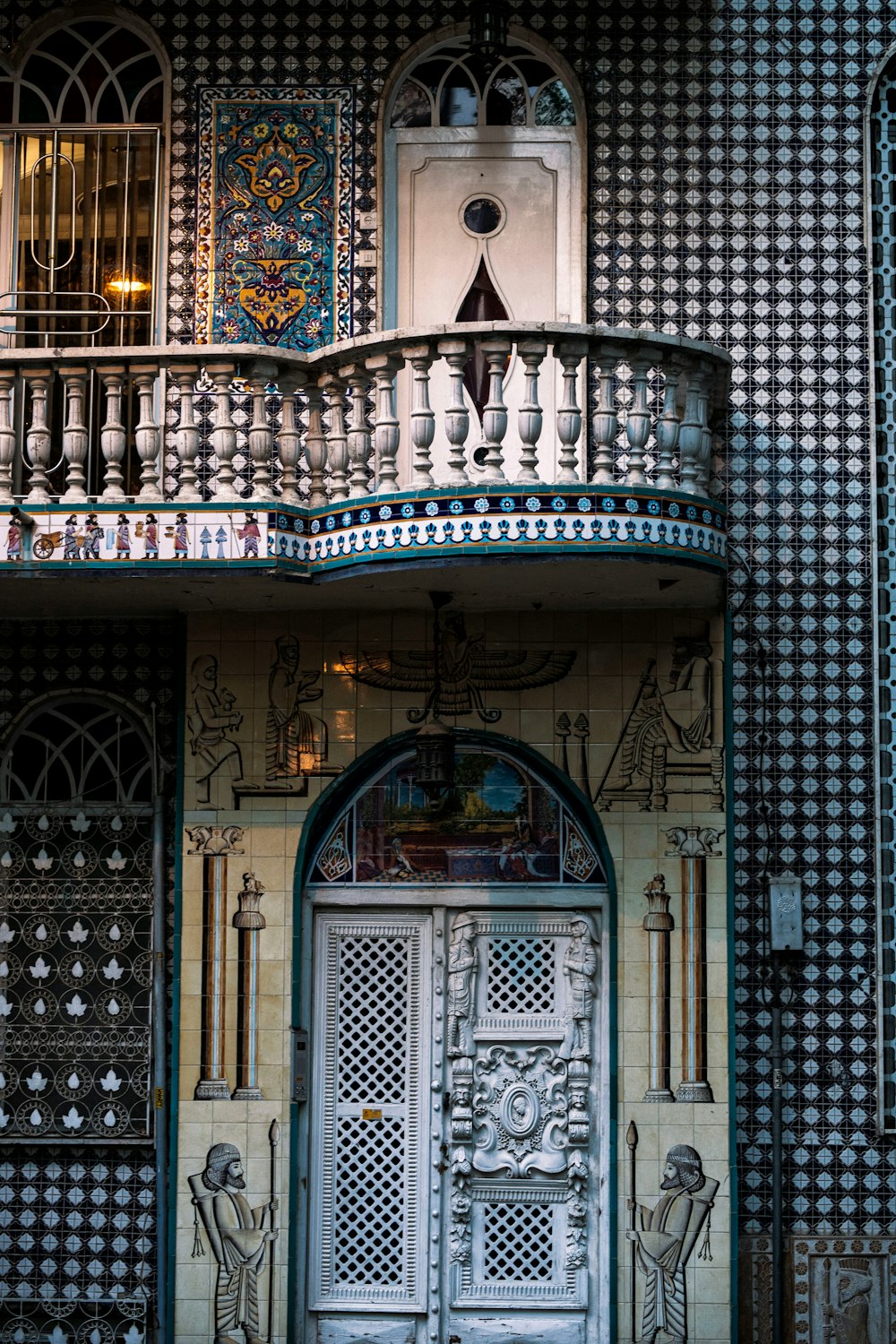 a building with a large door and a balcony