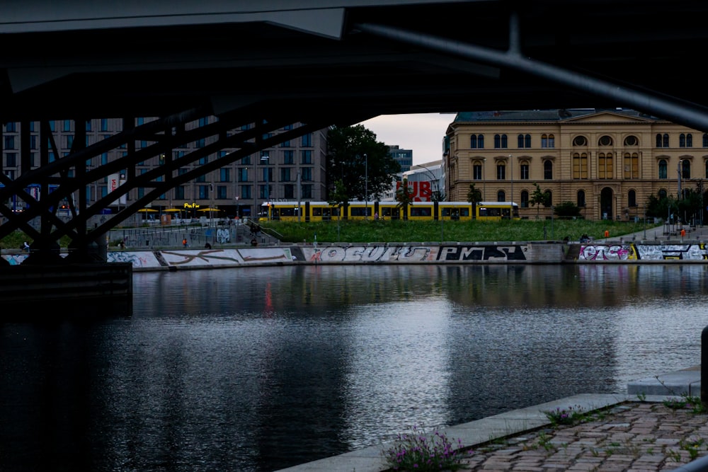 a body of water with a building in the background